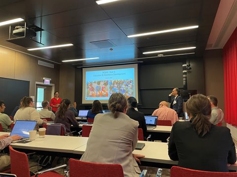 Angela Kou (left), HQAN MA3 co-lead finishes her presentation about research developments in her sector while HQAN Director Brian DeMarco (right) looks on.